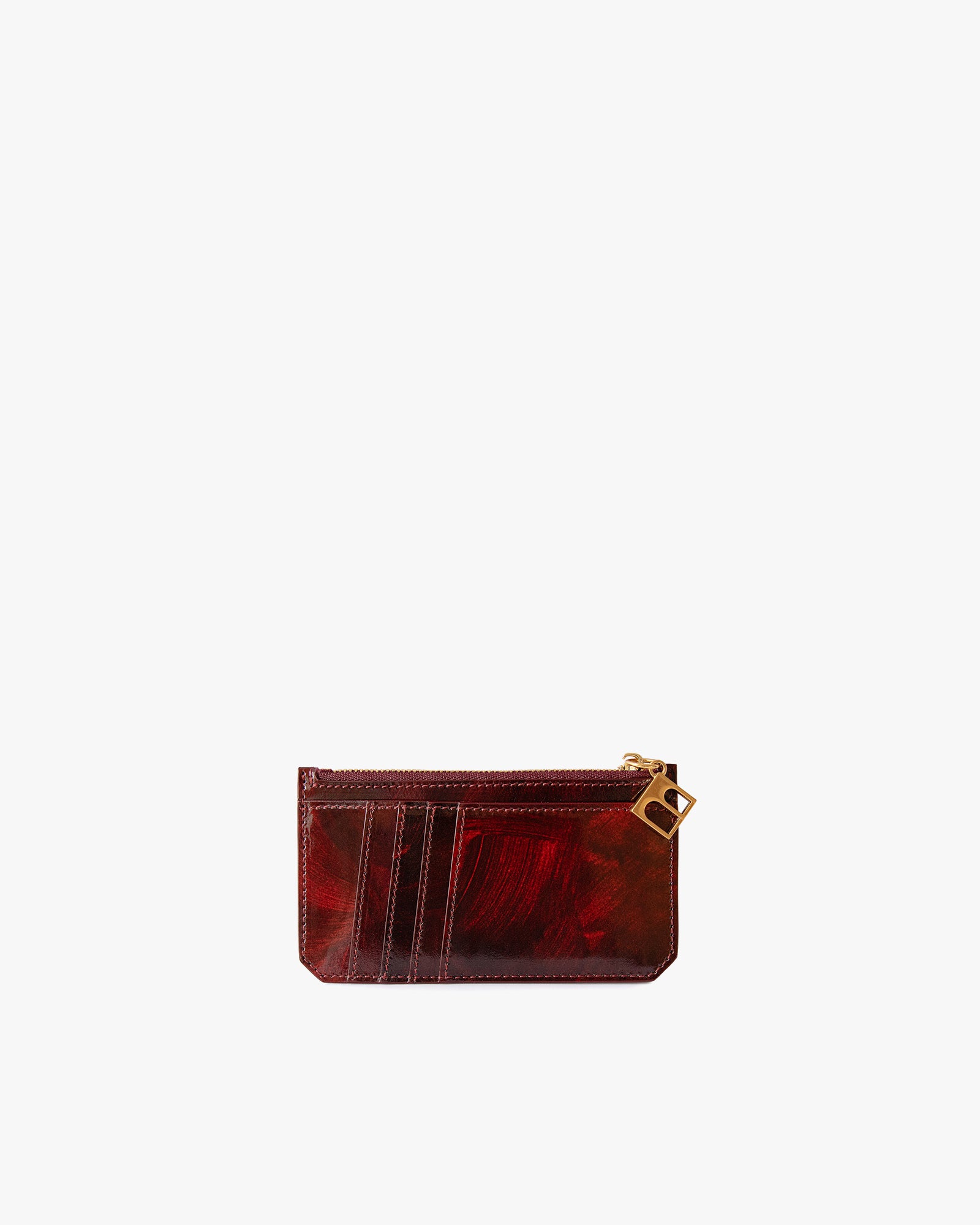 Porte-cartes JAMIE en cuir marbre marron et rouge, vue de face, fermeture zippée avec breloque dorée