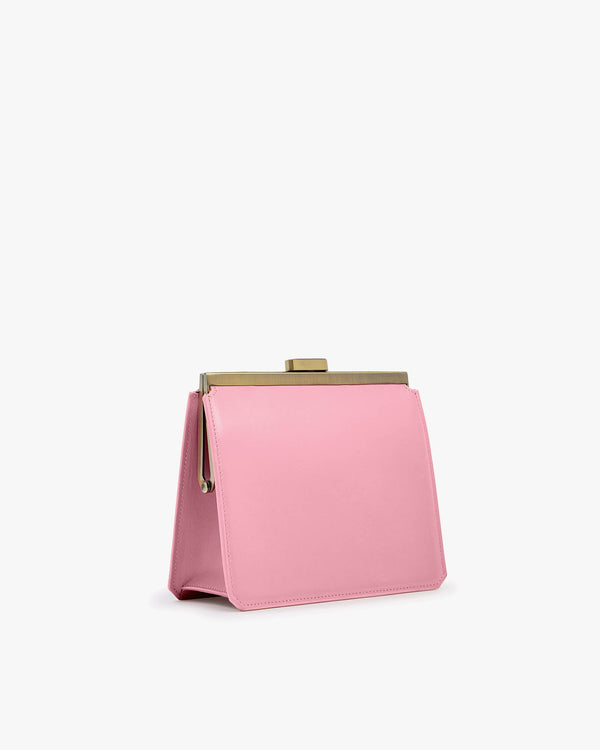 Sac JEANNE Blush vue de trois quarts, fermoir métallique doré, posé sans anse