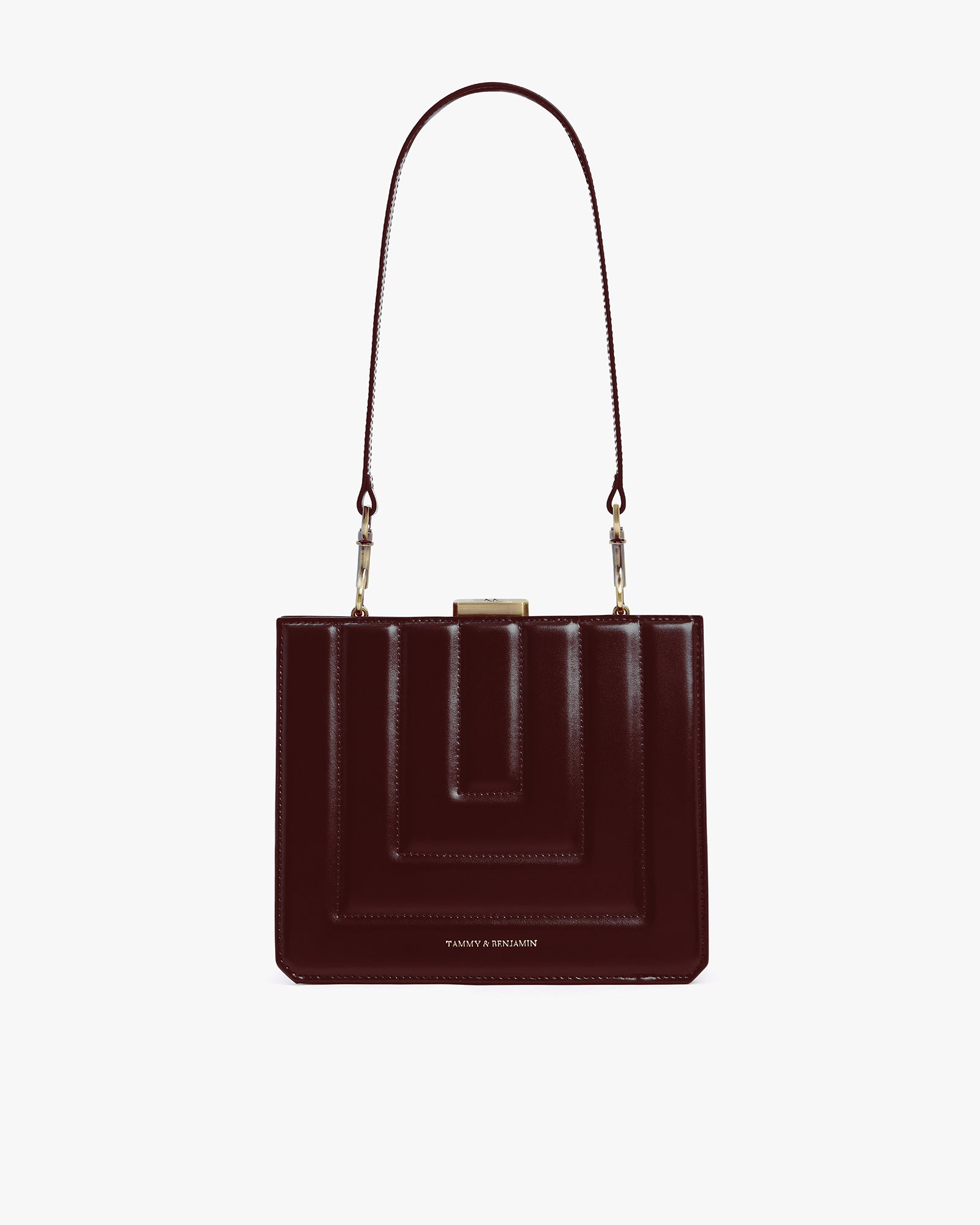 JUDE bag in mahogany quilted, front view, shoulder strap attached, gold clasp and visible stitching