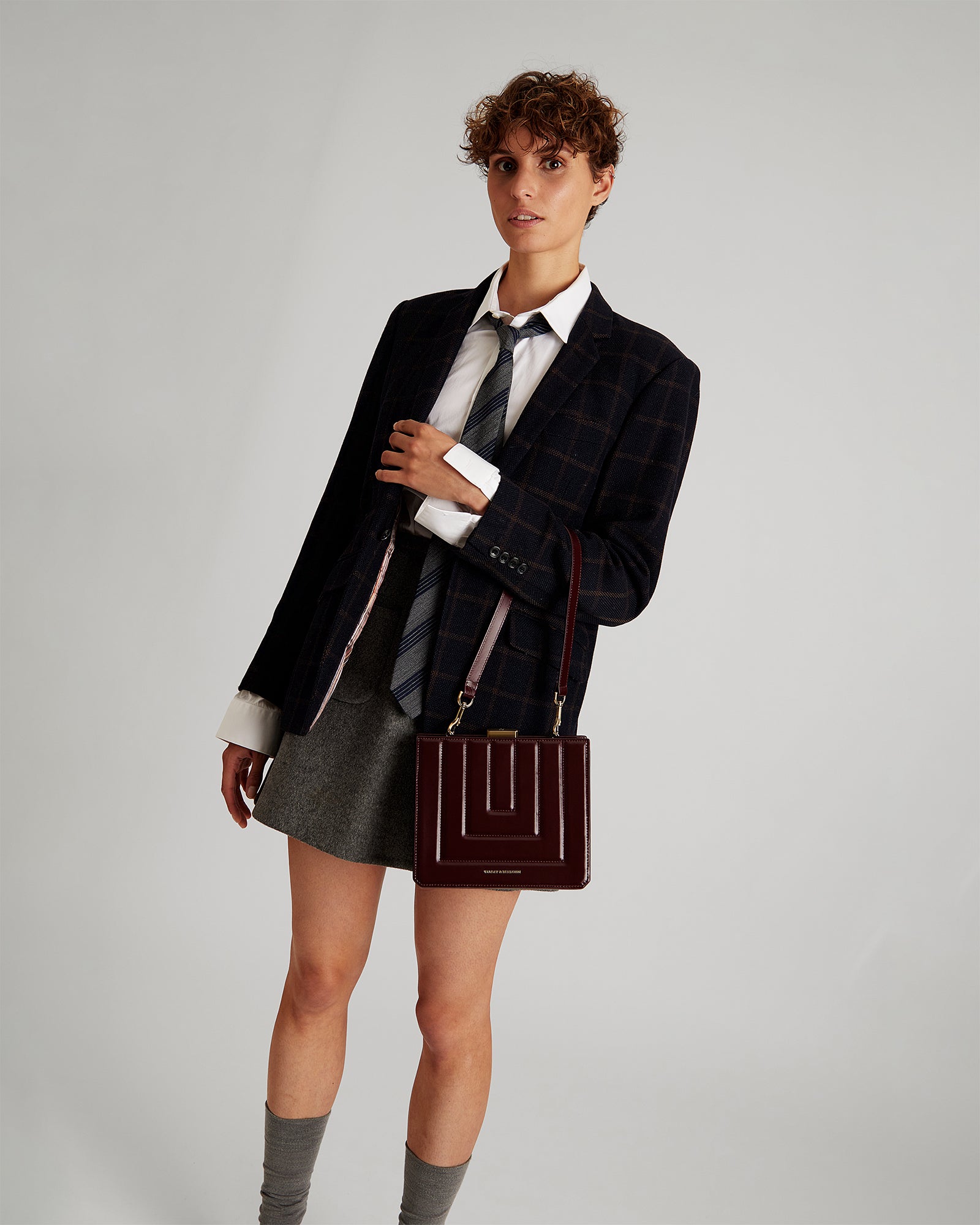 JUDE bag in Mahogany quilted, worn crossbody, front view on model