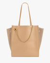 LEXI GM tote bag in beige, front view, shoulder straps, removable chain and suede side panels