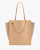 Sac cabas LEXI GM beige de face, anses portées, chaîne amovible et panneaux en suède sur les côtés