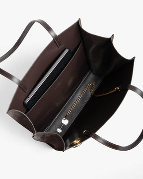 LEXI GM bag in Chocolate, open interior view, zip pocket, removable chain and laptop stored inside