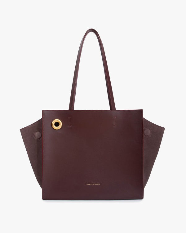 Sac cabas LEXI MM aubergine de face, anses portées, ailes en cuir et panneaux en suède ton sur ton