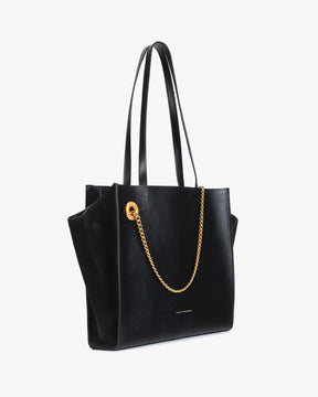 Sac LEXI MM Noir de trois quarts, ailes en cuir, panneau en suède, chaîne amovible, posé