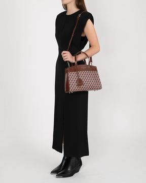 MADISON bag in brown monogram, worn on the shoulder, side view, long crossbody strap