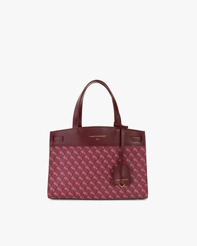 Sac MADISON Bordeaux de face, posé, avec anse courte et motif monogramme sur toile enduite