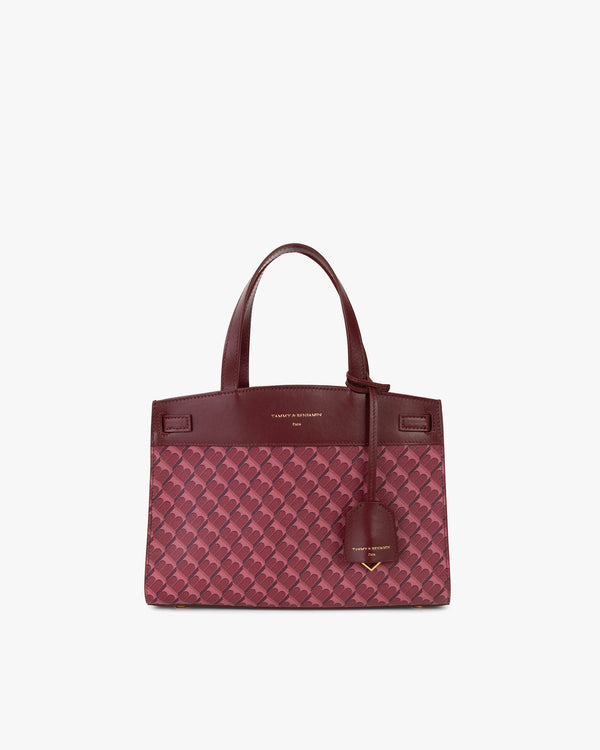 Sac MADISON Bordeaux de face, posé, avec anse courte et motif monogramme sur toile enduite