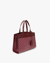 Sac MADISON Bordeaux vu de trois quarts, posé, anses courtes, motif monogramme et cuir lisse