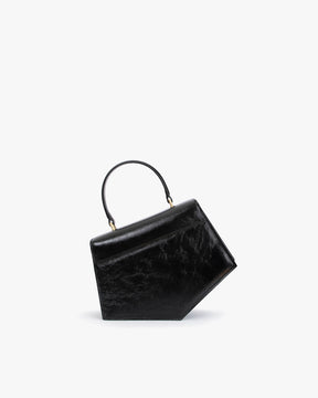 Sac PENTAGONE noir naplak de profil, posé, avec poignée structurée relevée