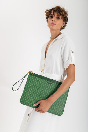 POCHETTE GM MONOGRAM in green printed coated canvas, held by the leather wrist strap
