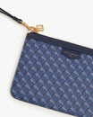 POCHETTE PM MONOGRAM in blue, close-up on zip, gold clasp and leather wrist strap