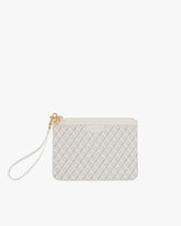 Pochette PM Monogram ivoire, vue de face, posée, avec dragonne en cuir détachée
