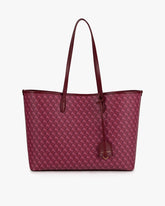 TOTE MONOGRAM Bordeaux, vue de face posé, anses longues en cuir et porte-adresse