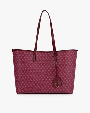 TOTE MONOGRAM Bordeaux, vue de face posé, anses longues en cuir et porte-adresse