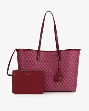 Sac TOTE MONOGRAM Bordeaux posé de face avec pochette zippée amovible assortie et porte-adresse