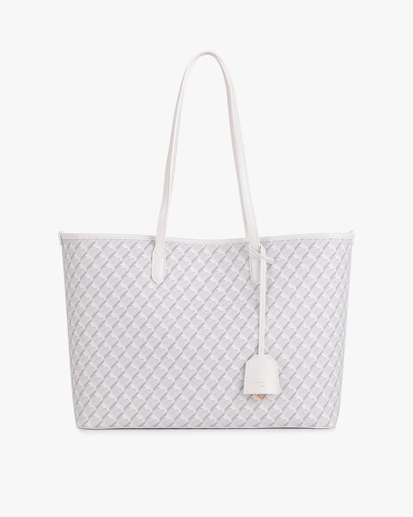 TOTE MONOGRAM blanc ivoire, vue de face, anses longues en cuir, posé sur fond blanc