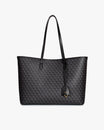 Sac TOTE MONOGRAM noir, vue de face, posé, anses longues en cuir et pampille logo