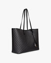 TOTE MONOGRAM noir, vue de trois quarts, anses longues en cuir, porté épaule, posé