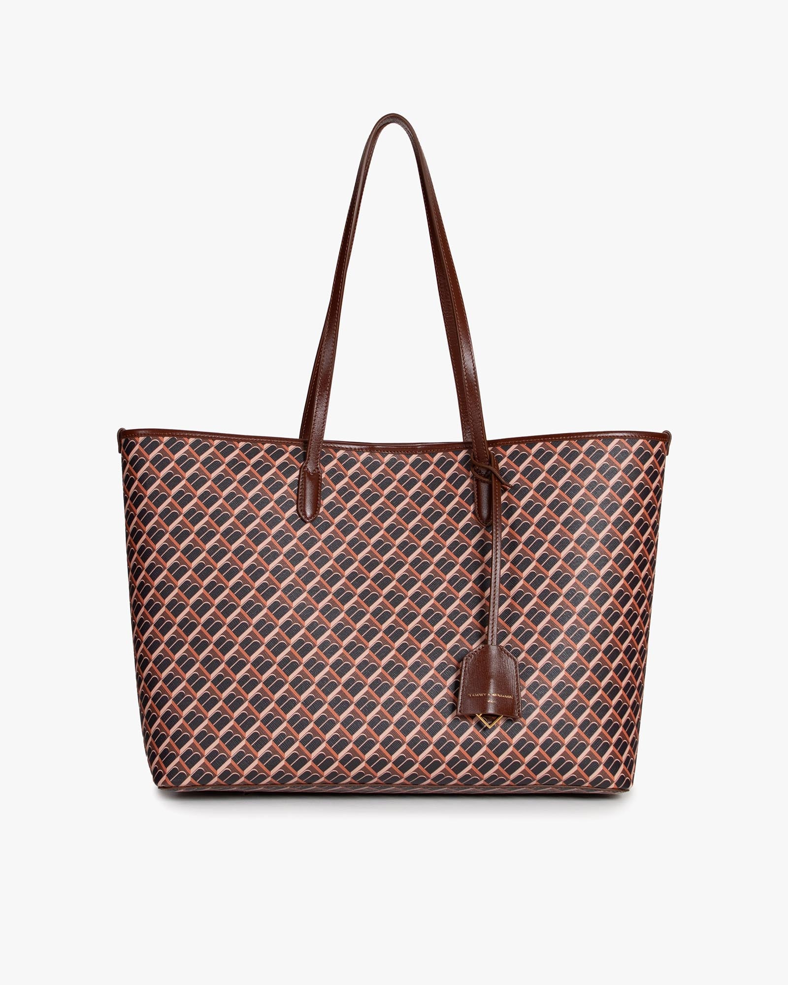 TOTE MONOGRAM in brown, front view, standing, long leather handles and hanging tag visible