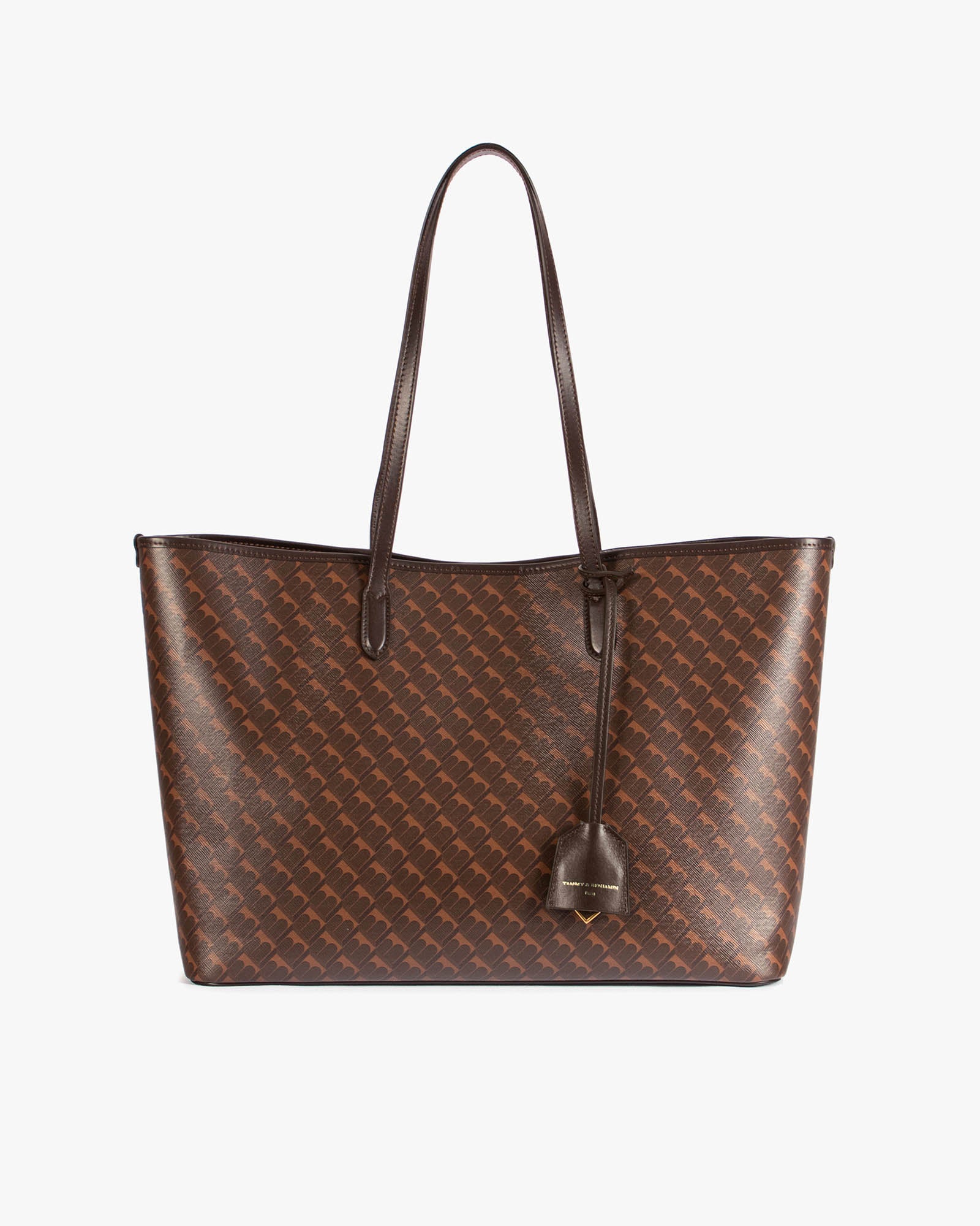 TOTE MONOGRAM Chocolat posé de face, anses plates en cuir, motif monogram sur toile enduite