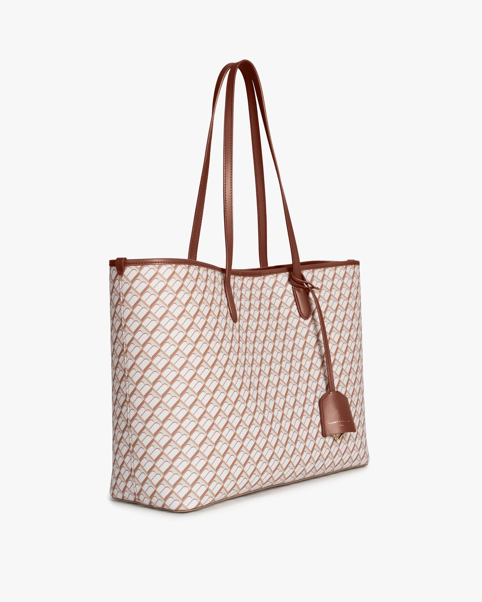 TOTE MONOGRAM Tan et brun, vue de trois-quarts, anses longues en cuir, posé