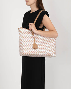 TOTE MONOGRAM Tan porté à l'épaule, motif monogram et anses plates en cuir
