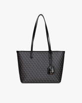 TOTE MONOGRAM PM noir, vue de face, posé, avec ses deux anses plates et sa breloque en cuir