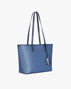 TOTE MONOGRAM PM bleu, vue de trois quarts, posé, anses hautes et étiquette cuir apparentes