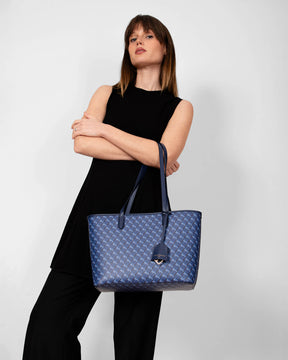 TOTE MONOGRAM PM bleu, porté à la main, anses croisées, toile imprimée monogramme