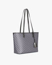 TOTE MONOGRAM PM gris, vue de côté posé, anses jointes, porte-étiquette en cuir en évidence
