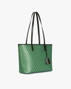 TOTE MONOGRAM PM vert, vue de trois quarts, anses hautes en cuir, posé sur fond blanc