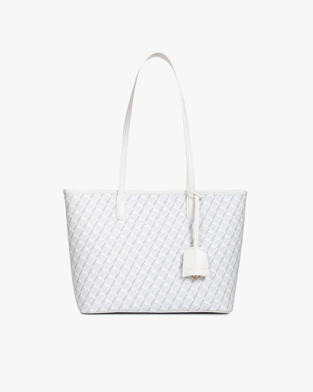 TOTE MONOGRAM PM blanc ivoire, vue de face posé, anses plates et porte-adresse en cuir