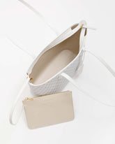 TOTE MONOGRAM blanc ivoire ouvert, intérieur beige et pochette amovible zippée sortie du sac