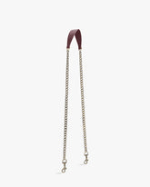 CHAÎNE LONGUE strap in Aubergine, leather shoulder pad, laid flat in a U-shape, clasps visible at both ends