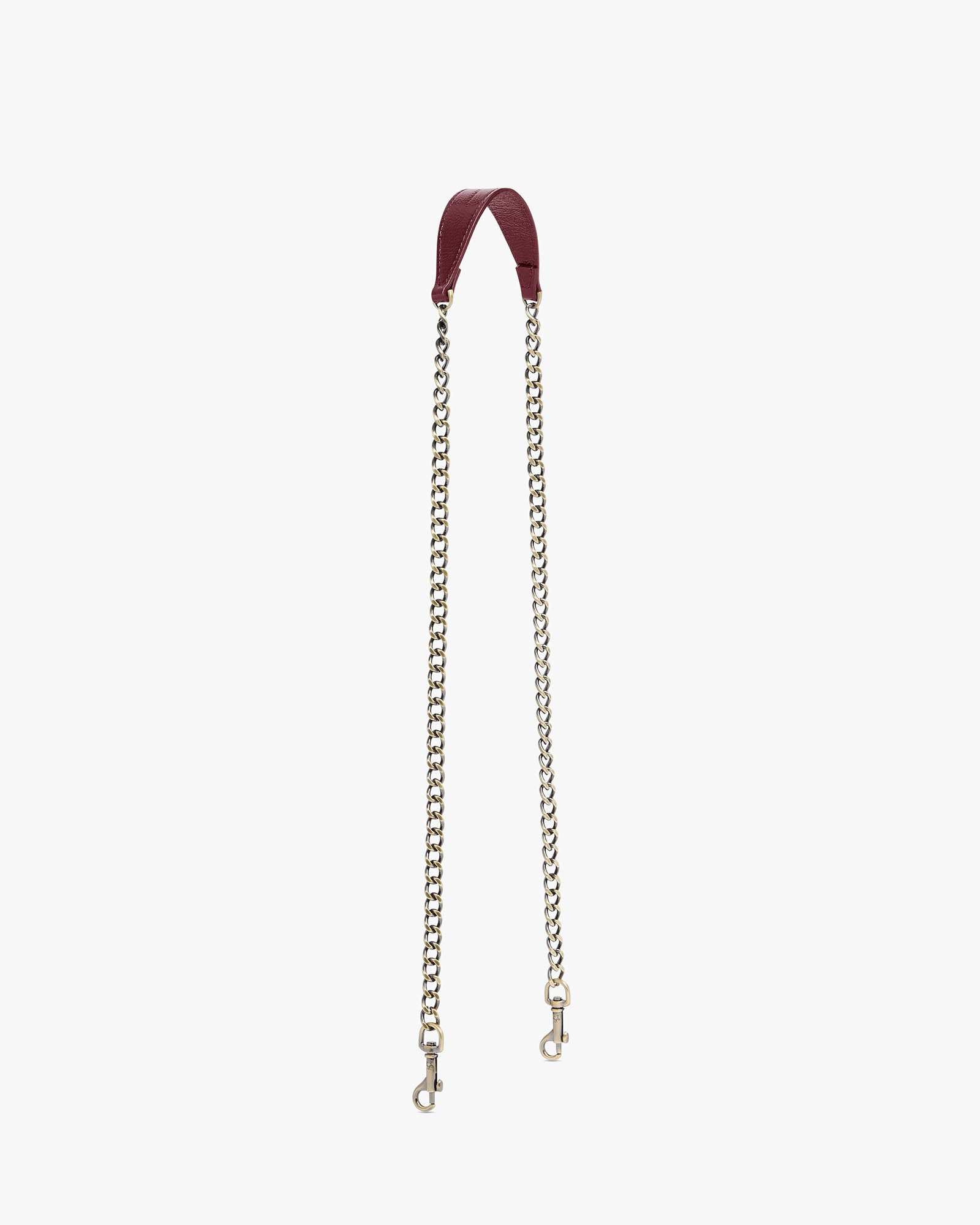 Long chain Bordeaux naplak, laid flat, leather strap and aged brass chain with clasps