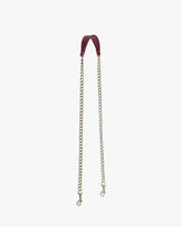 Long chain Bordeaux naplak, laid flat, leather strap and aged brass chain with clasps