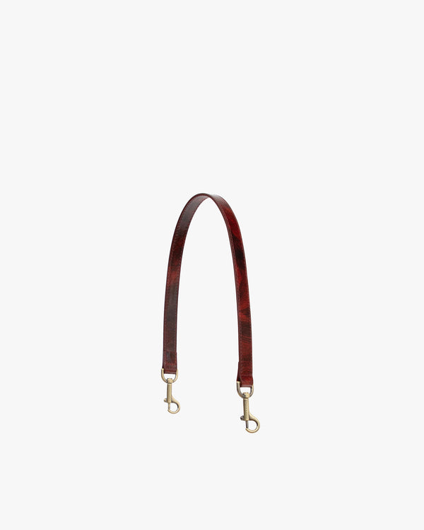Bandoulière courte Marbre en cuir, vue d'ensemble avec mousquetons en laiton vieilli