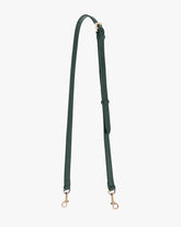 Adjustable thin strap in emerald green laid out full length, showing jewel buckle and gold-tone clasps