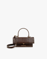 Sac THEA MINI brun embossé lézard, vue de face, rabat fermé, anse courte et bandoulière amovible