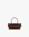 Sac THEA MINI brun embossé lézard, vue de face, posé, rabat fermé et anse supérieure