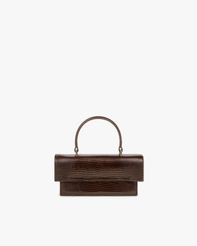 Sac THEA MINI brun embossé lézard, vue de face, posé, rabat fermé et anse supérieure