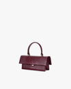 Sac THEA MINI Bordeaux embossé lézard, vue de trois quarts, posé, anse courte relevée