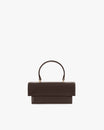 THEA MINI bag in chocolate, front view, standing, with rounded handle and oversized flap