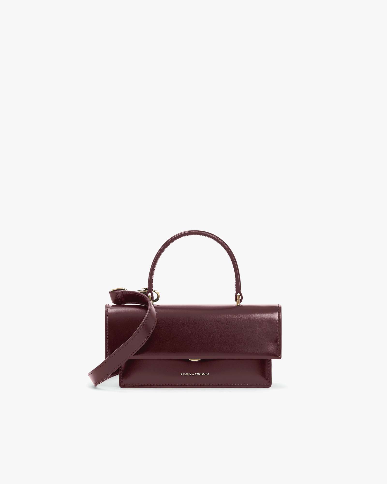 THEA MINI bag in Mahogany, front view, flap closed, top handle with detachable strap