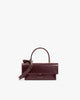 Sac THEA MINI Mahogany de face, rabat fermé, anse courte et bandoulière amovible posées