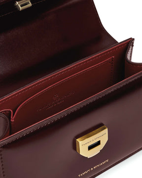 THEA MINI bag in Mahogany open, interior view showing pocket and gold clasp