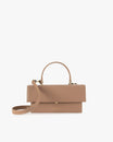 THEA bag in beige, front view, closed flap with top handle and adjustable strap