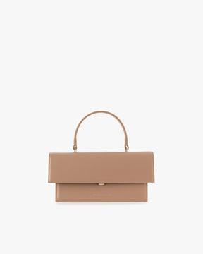 THEA bag in beige, front view, flap closed, top handle, white background