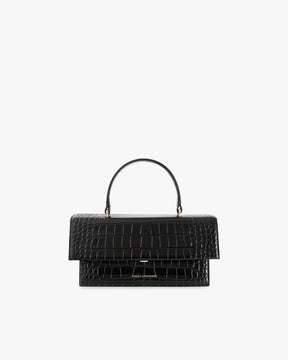 Sac THEA noir embossé crocodile, vue de face, posé, avec poignée rigide